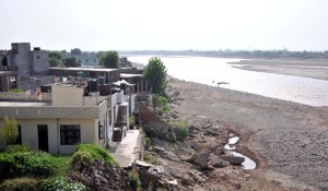One year after flash floods, illegal construction continues along Tawi