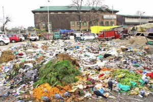 City reels under garbage heaps