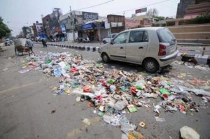 Municipal Corporation employees go on indefinite strike, dump garbage on roads