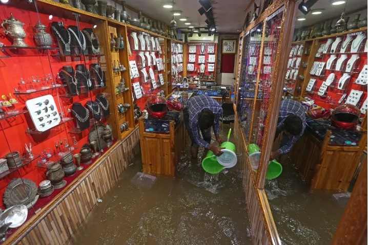 Nearly half a dozen shops inundated in Srinagar's Polo View market after overnight rainfall
