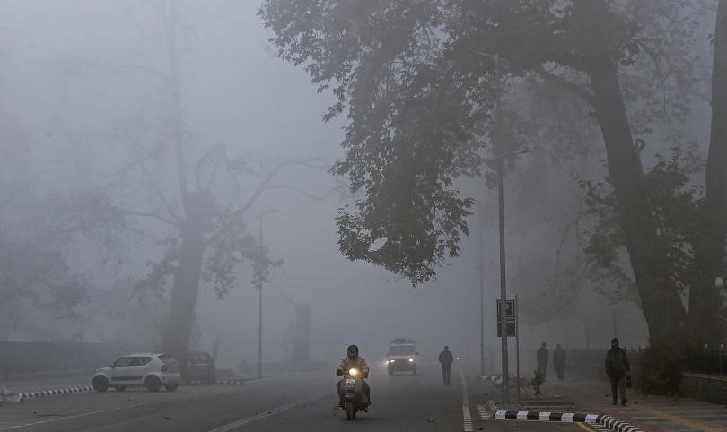 Frozen in Time: Kashmir Shimmers Under a Frosted Fog Blanket