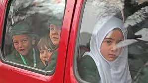 School Van Packed Like a Backpack: Seized for Child Overload!
